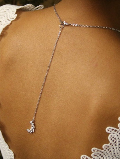 Pendentif de dos mariage croissant de lune sertis marquises