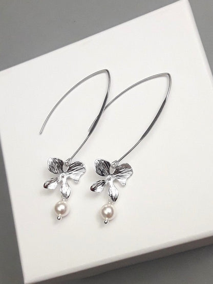 Longues boucles d'oreilles mariage fleurs orchidées