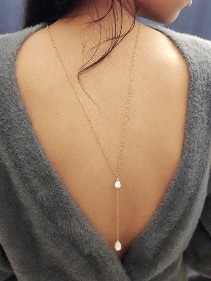 Collier bijou de dos fleurs de nacre jacinthe
