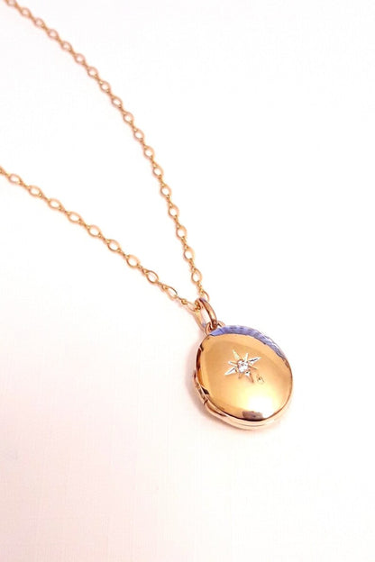 Pendentif ovale cassolette porte-photo et zirconium