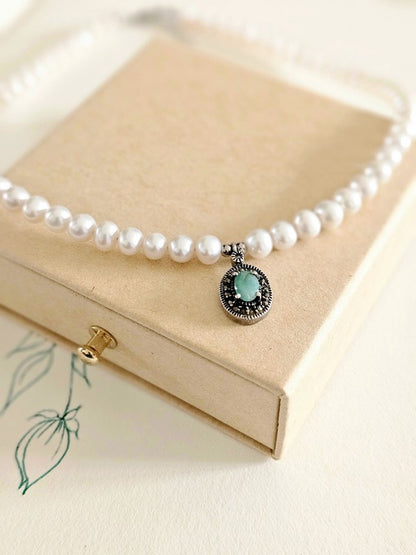 Collier tour de cou perles de culture d'eau douce et pendentif marcassites