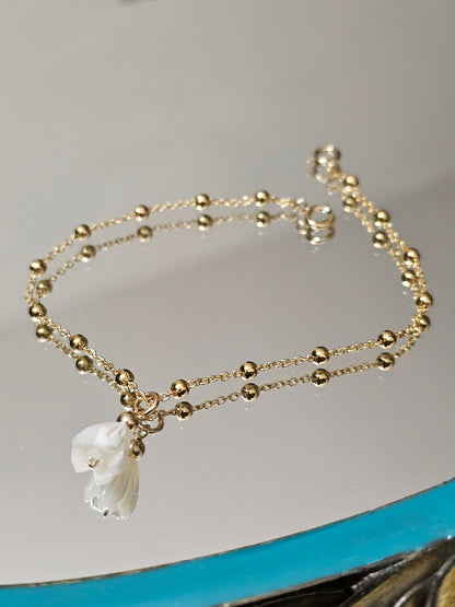Commande personnalisée Johan D. - Créoles ovales fleurs de nacre et bracelet boules fleur de nacre