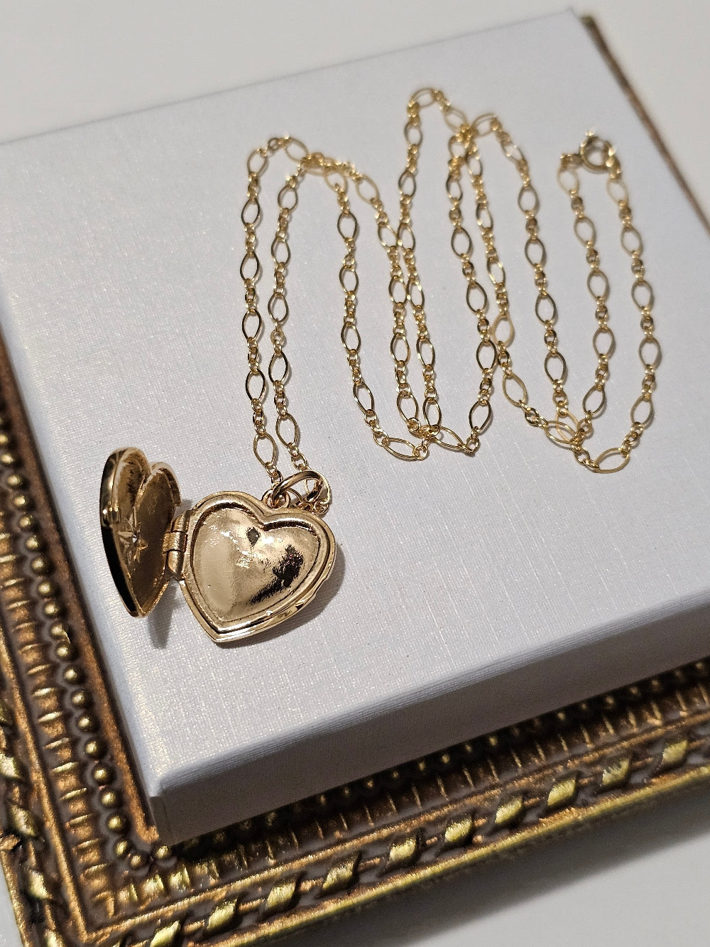 Pendentif coeur cassolette porte-photo et zirconium